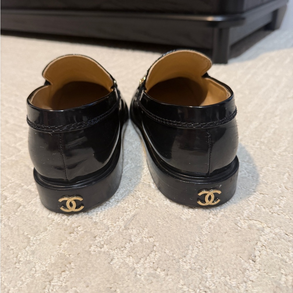CHANEL Glossy Black Loafers with Gold Accents - Picture 3 of 5